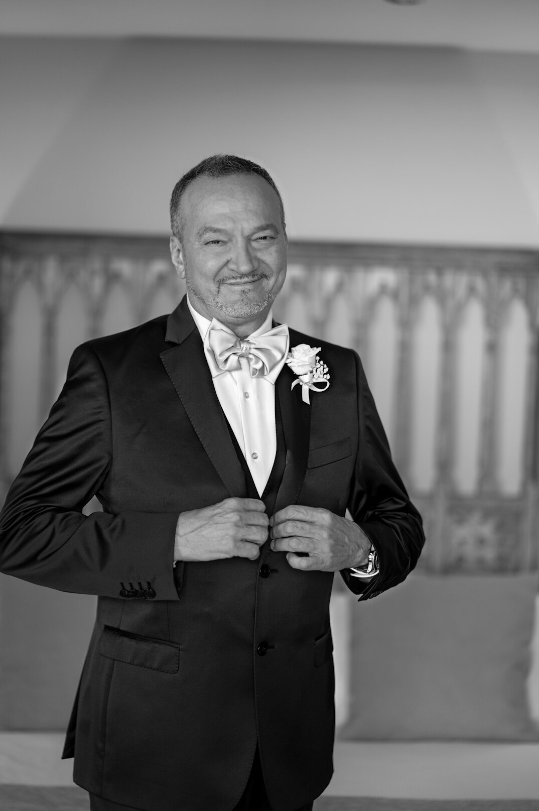 Studio portrait of a man in his fifties wearing a suit